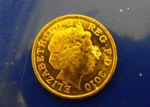 A Fatal Dose of White Phosphorus on the nose of the Queen - on a 1p coin